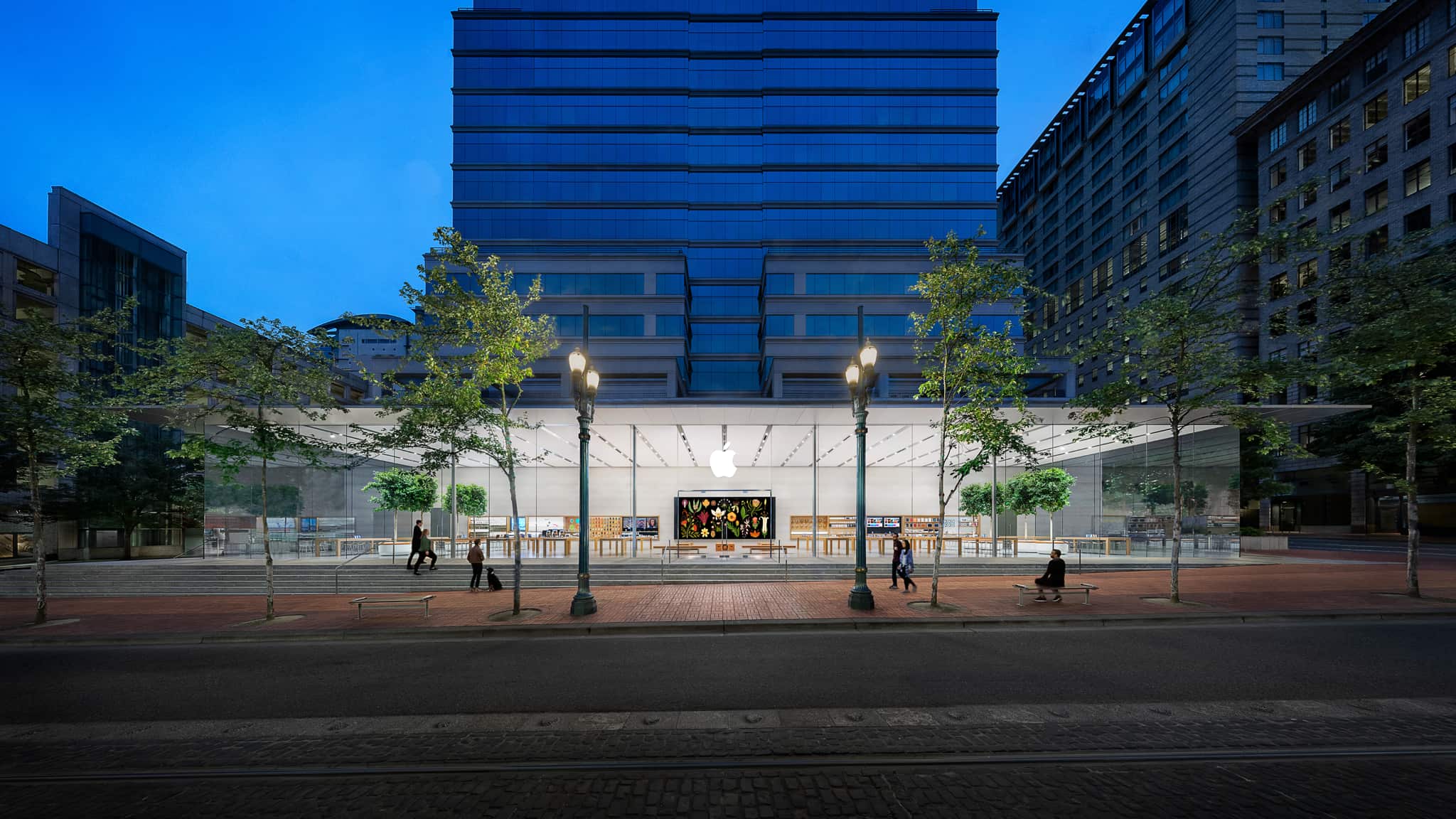 Exterior view of Apple Pioneer Place located in downtown Portland featuring a pavilion design built on a slope with a 165 foot wide glass facade.